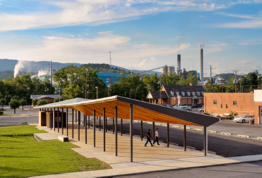 Image shows Covington’s new open-air pavilion, with trees and industrial buildings in the background.